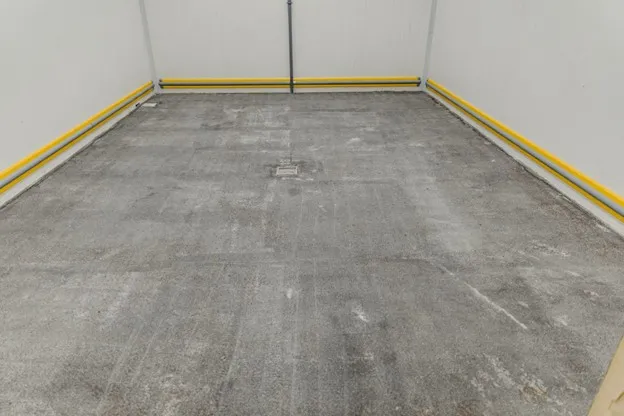 Newly poured and leveled concrete slab with proper reinforcement and smooth finish in Frisco, TX